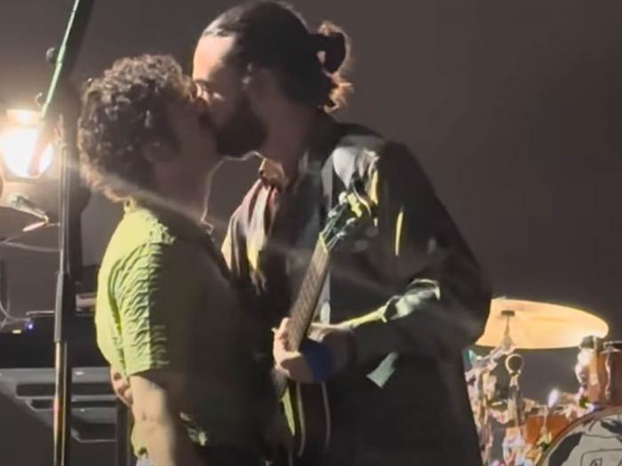 The 1975 frontman Matty Healy, left, kissed bassist Ross MacDonald on stage at the Good Vibes Festival in Kuala Lumpur, Malaysia July 21. Photo: Courtesy Sky News