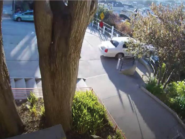 A car that was allegedly carjacked plummeted over the Sanchez Street stairs in the Castro July 22. Photo: Julia Brown's YouTube <br>